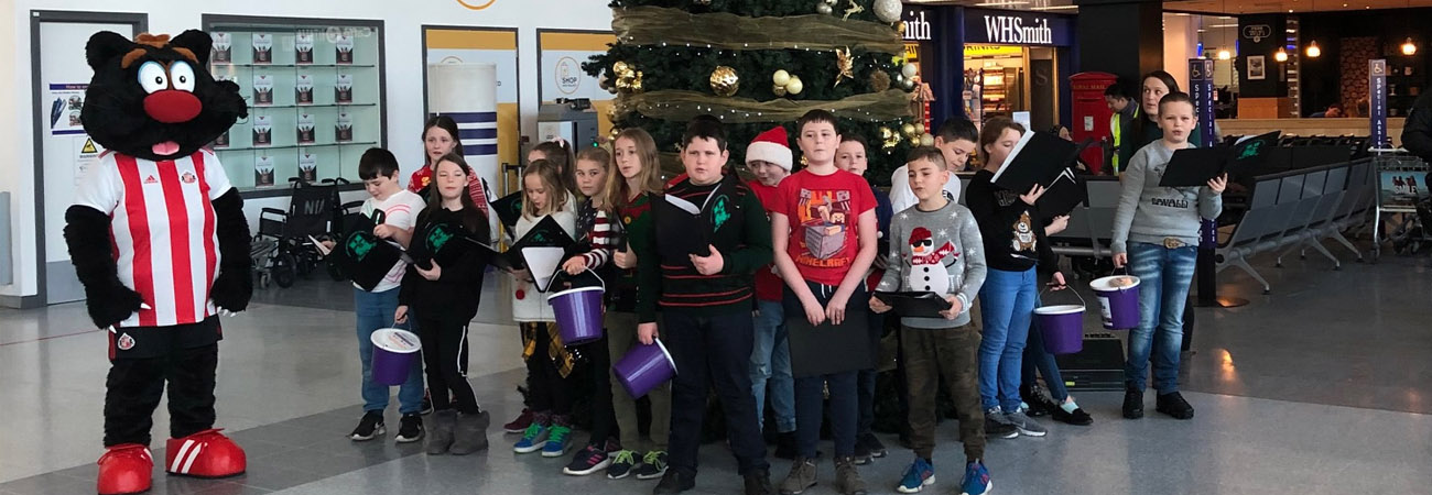 Pupils on song for passengers 